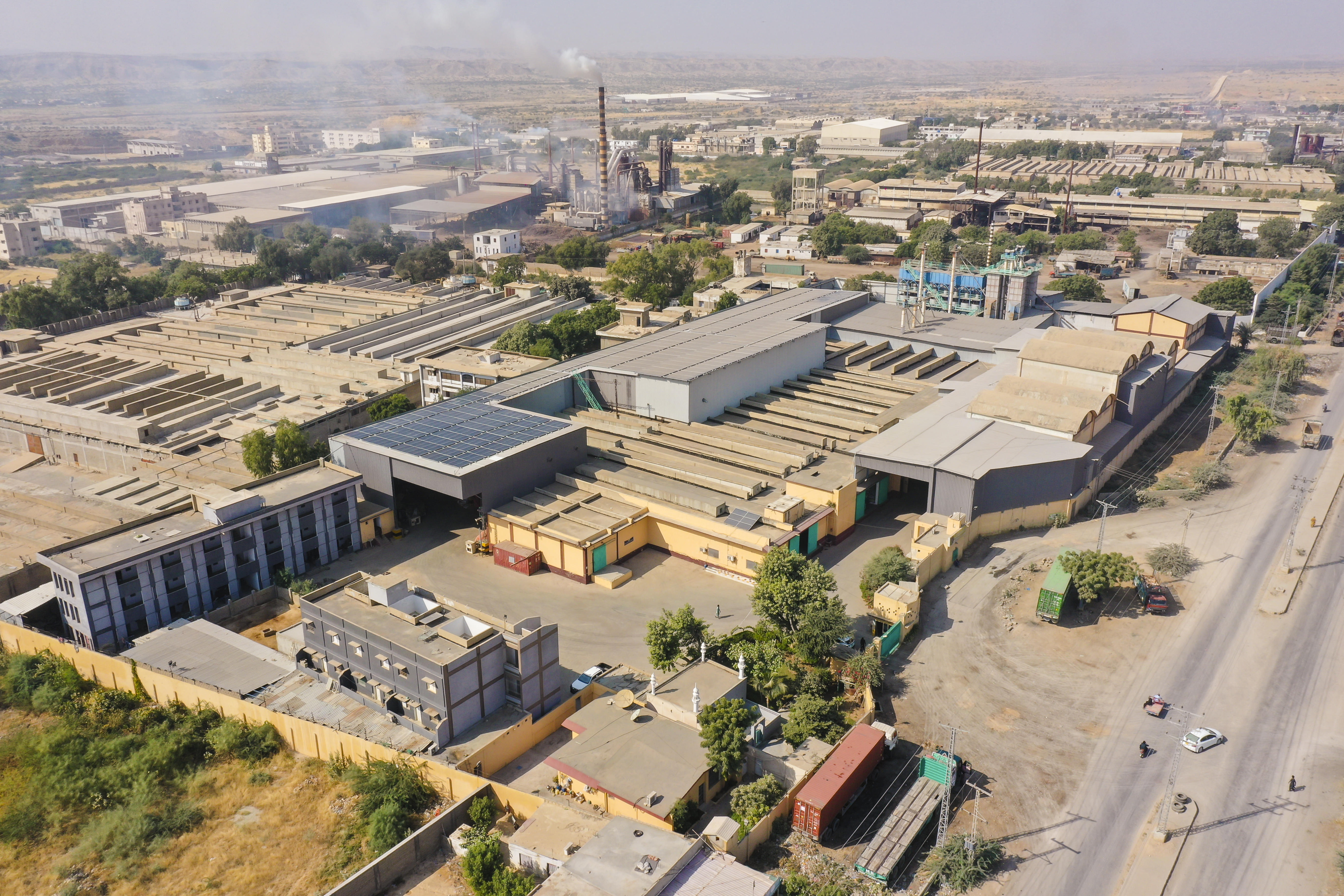 Aerial view of large industrial factory complex with multiple buildings
