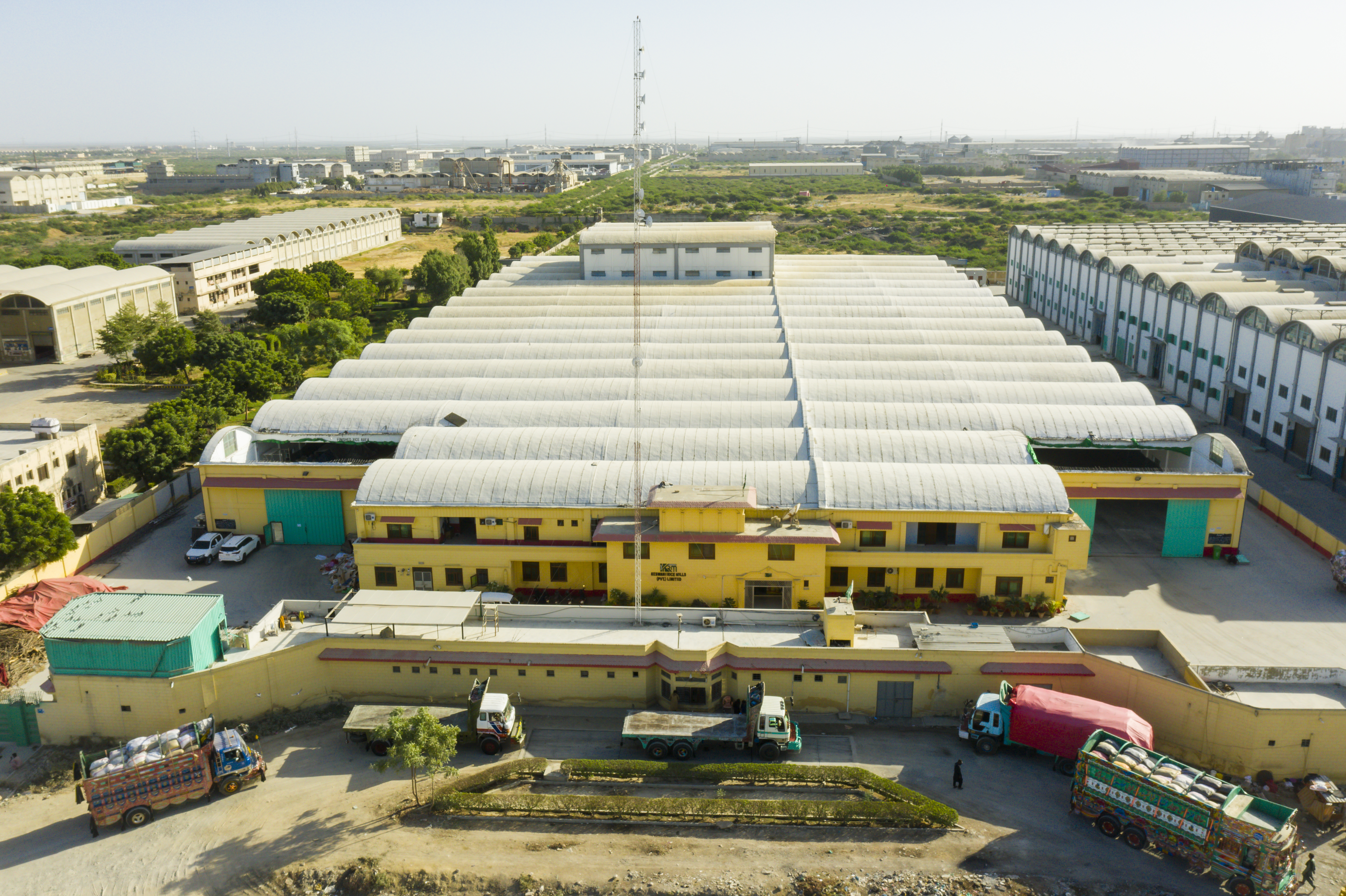 Large warehouse facility with rows of storage units and central building