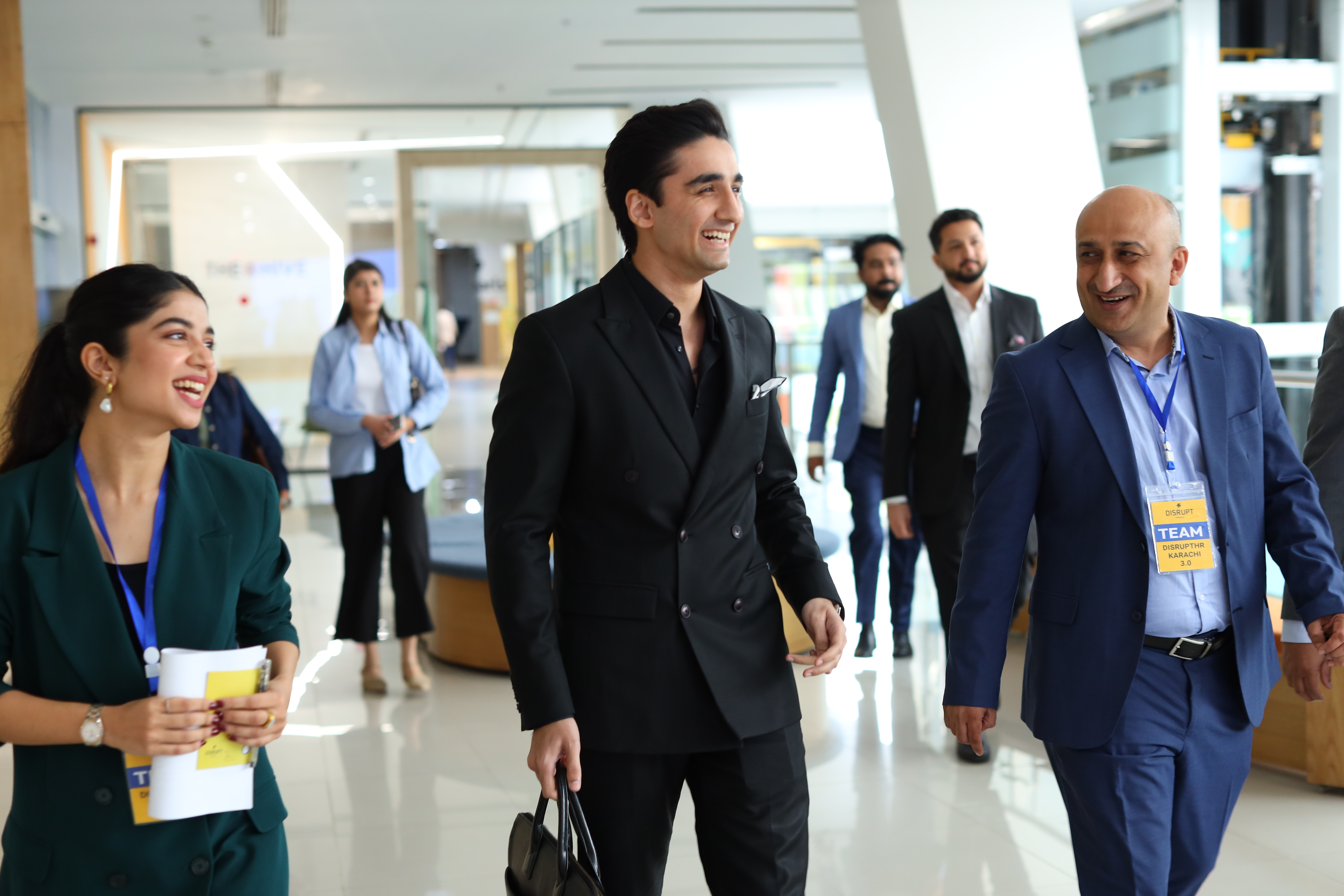 Business professionals walking together in modern office environment