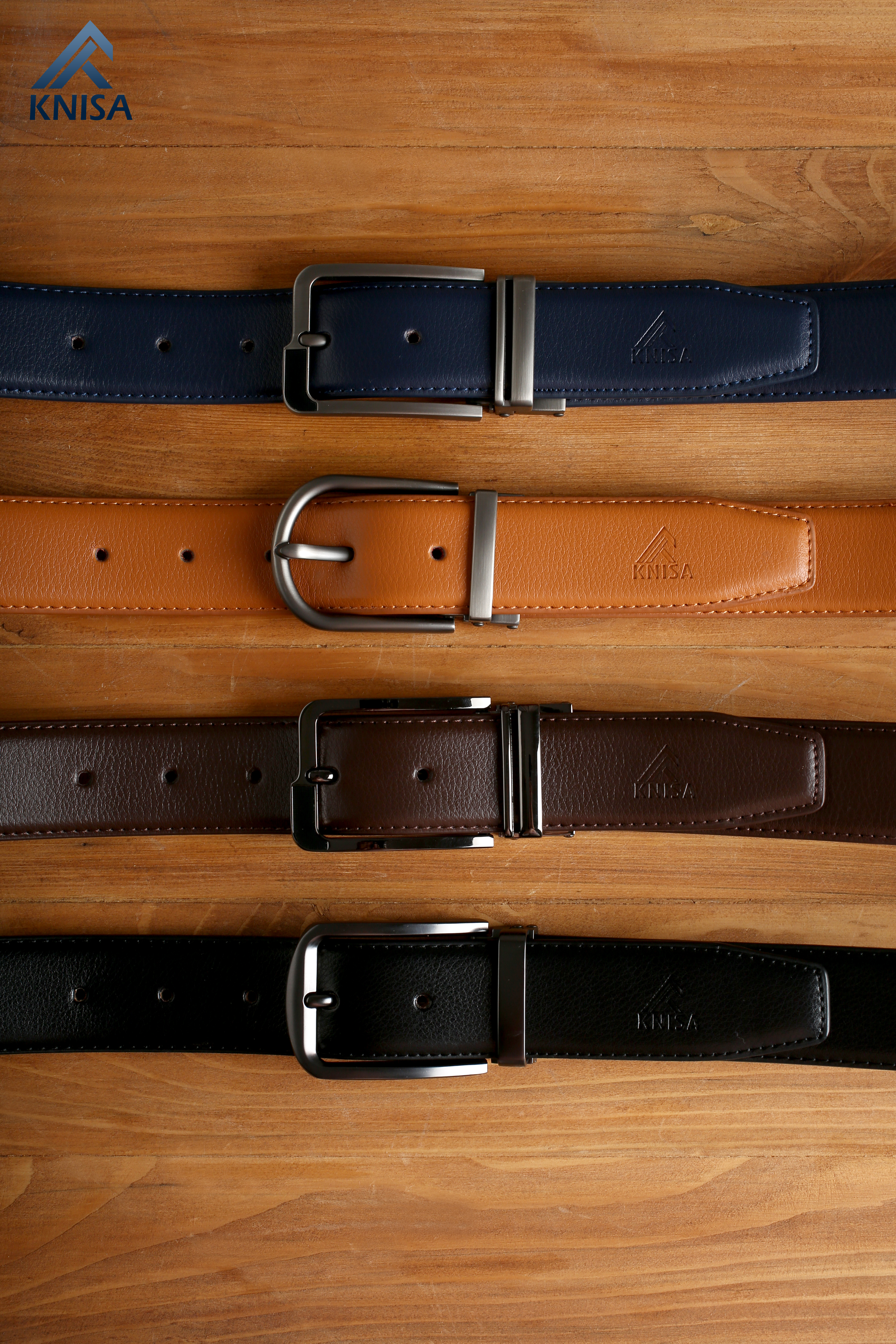 Collection of leather belts in different colors with metal buckles
