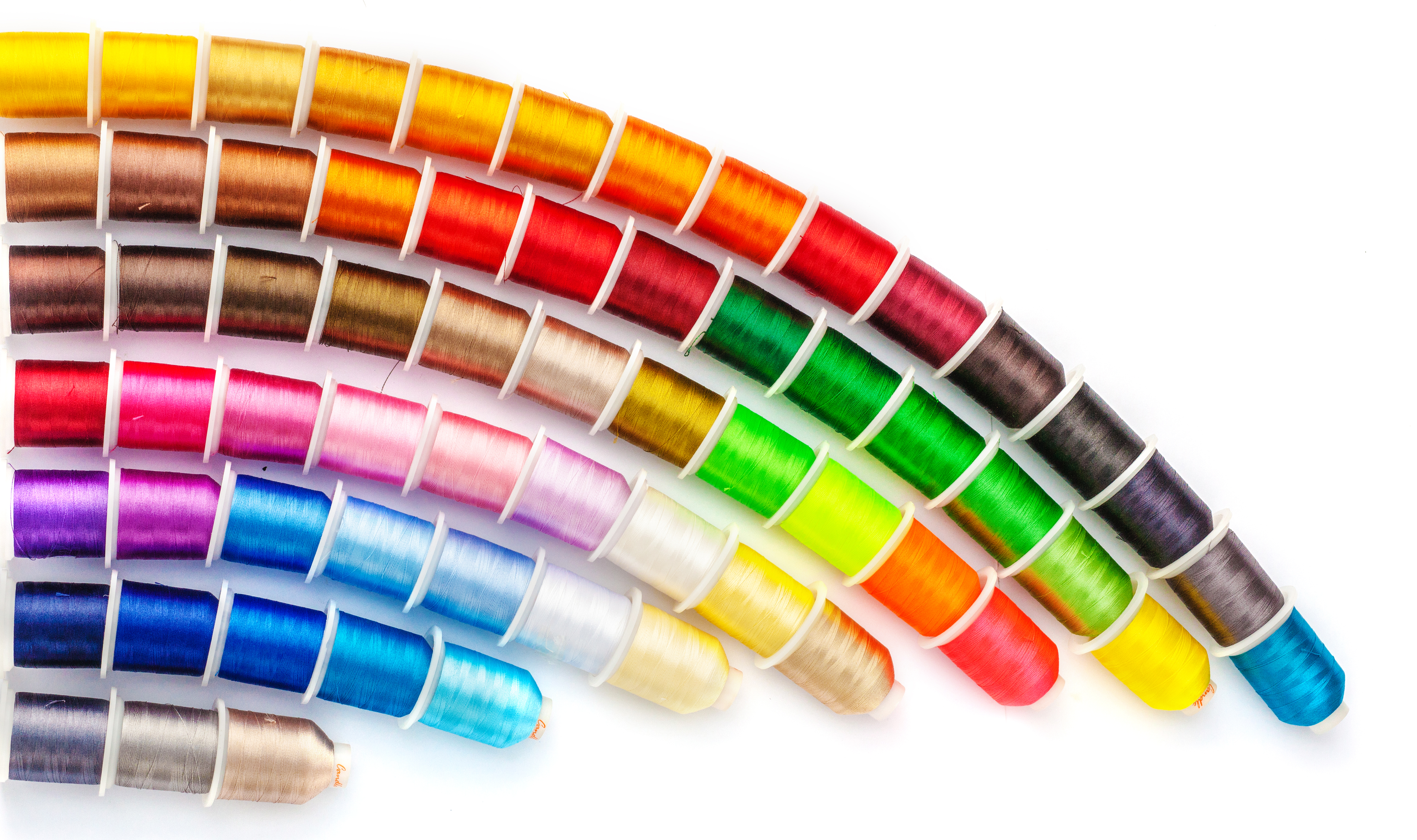 Vibrant sewing threads in multiple colors neatly displayed for textile work