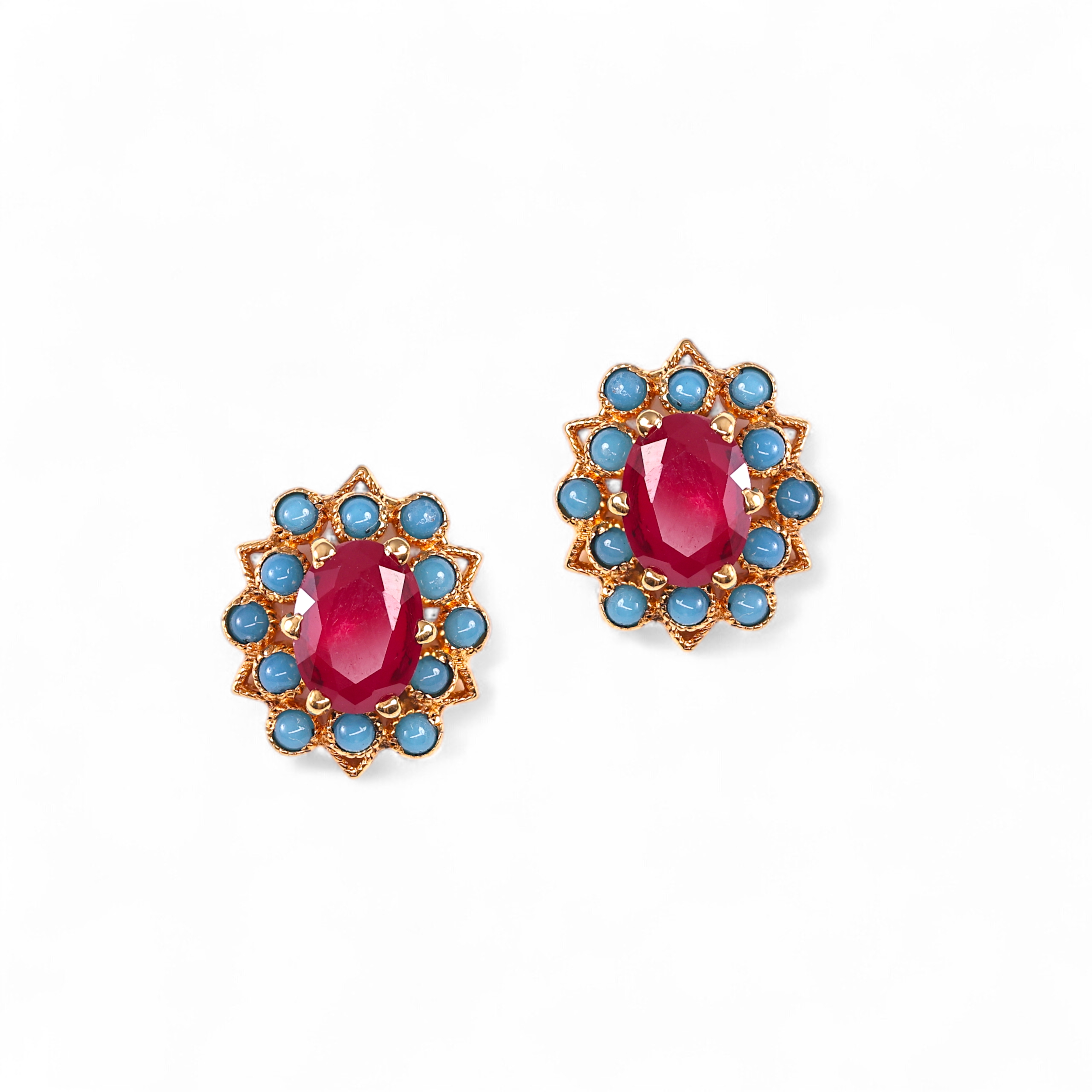 Stylish earrings with red center stones and blue gemstone accents