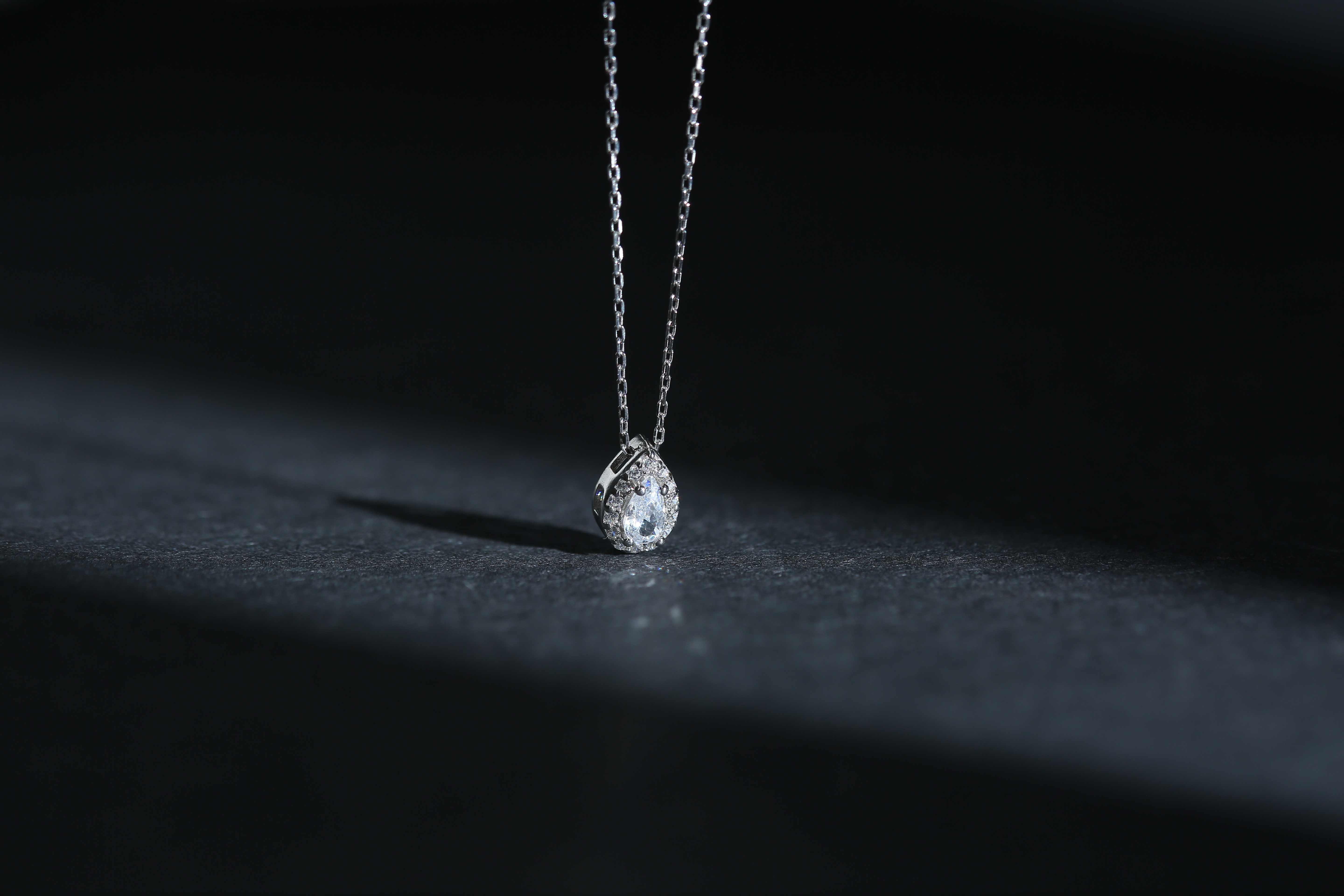 Minimalist diamond pendant necklace on silver chain